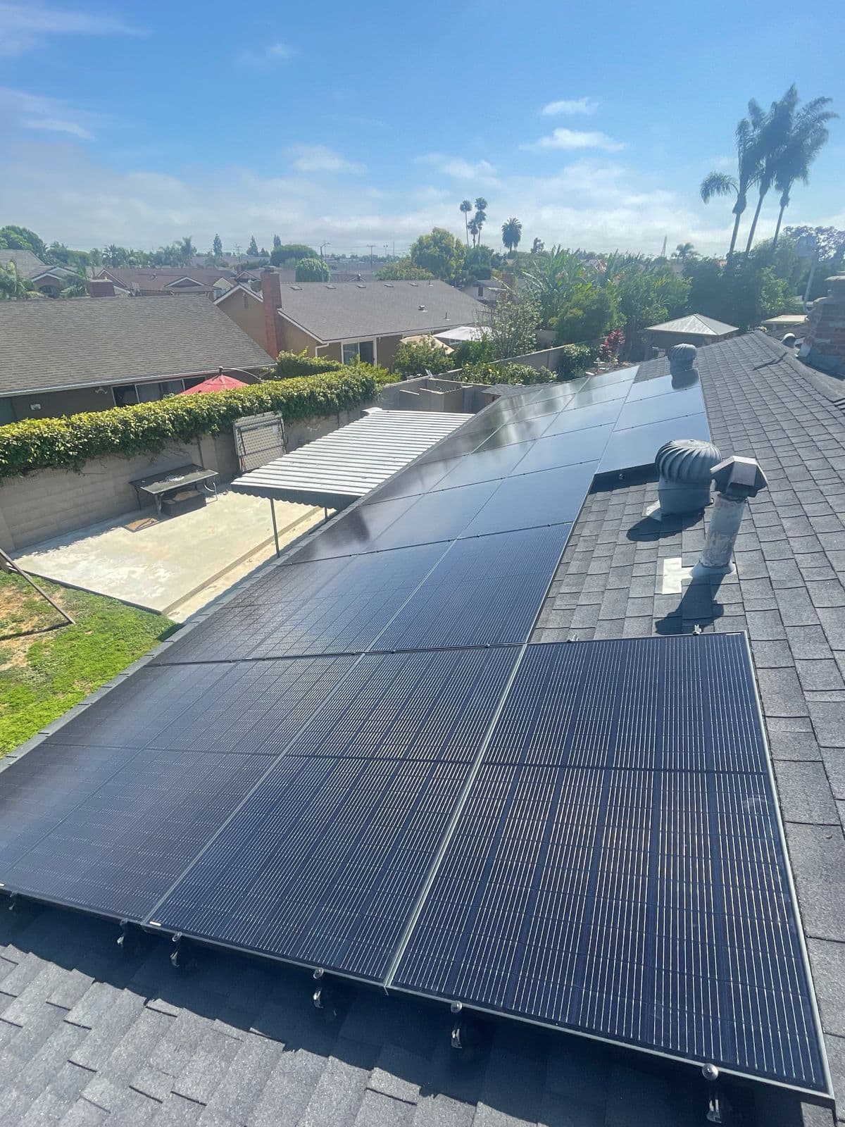 Close-up of sleek black solar panels on a California roof